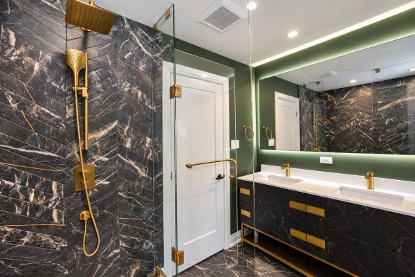 Designer bathroom with chevron tiles and gold accents - Toronto