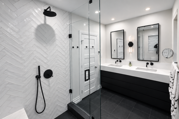 Designer bathroom with herringbone tile and wall mounted faucets - Toronto